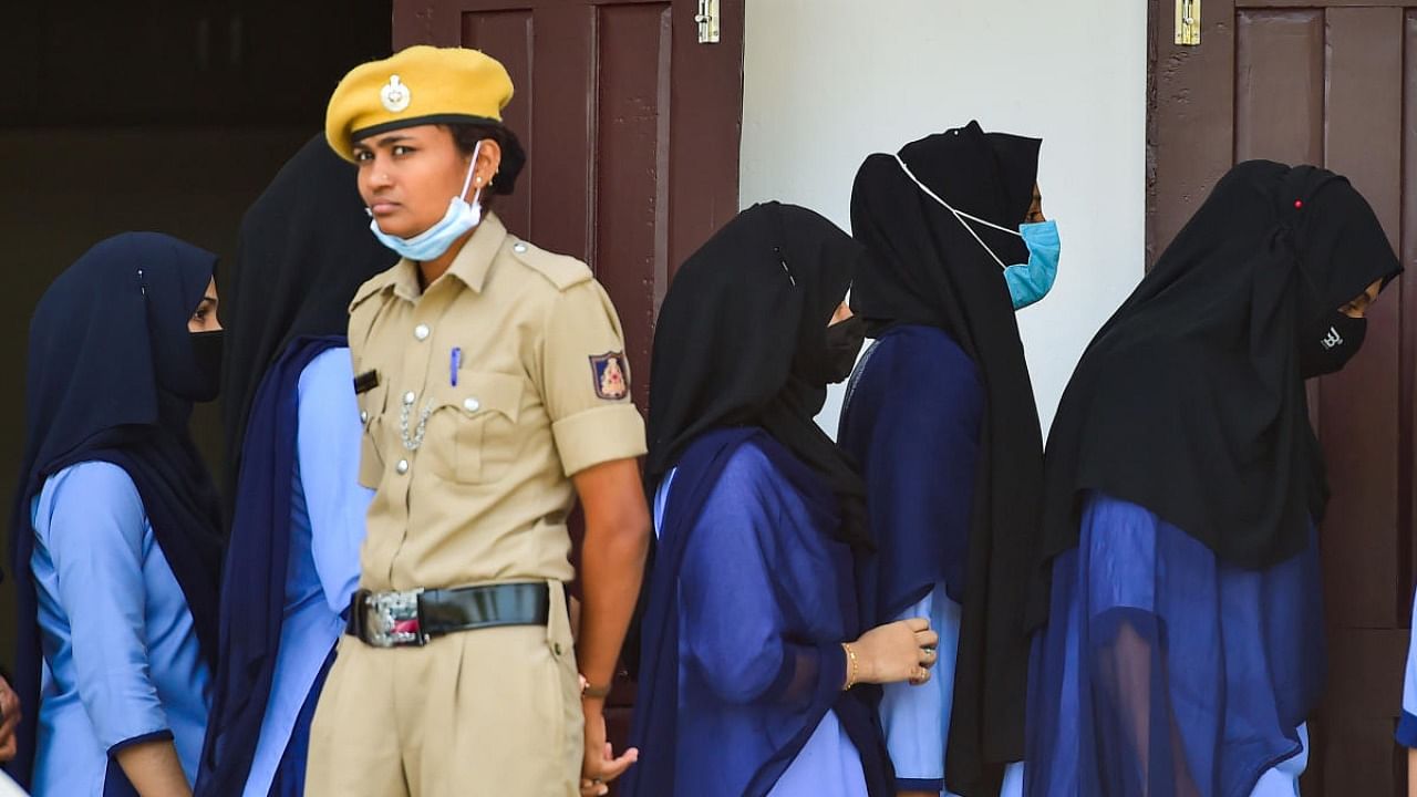 Students seen in hijab as colleges reopen. Credit: DH Photo