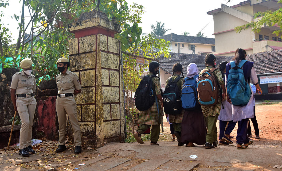 Students enter the campus of Government PU College in Udupi, after colleges that had shut down due to the controversy surrounding the wearing of the hijab, reopened across the district on Wednesday.