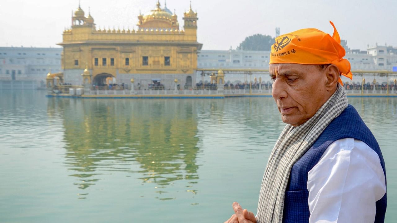 Defense Minister Rajnath Singh offers prayers at the Golden Temple, in Amritsar. Credit: PTI Photo