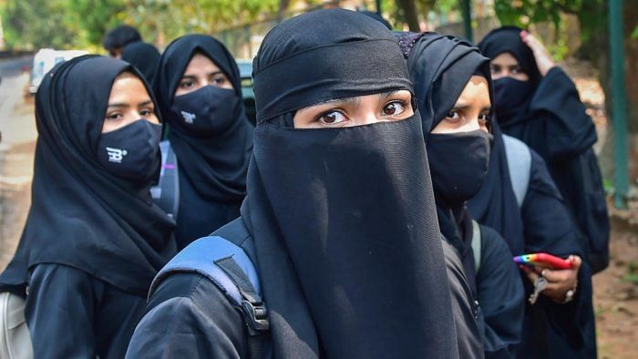 Students leave after they were not allowed to attend classes while wearing Hijab, at Dr G Shankar Government Women's First Grade College in Udupi. Credit: PTI Photo