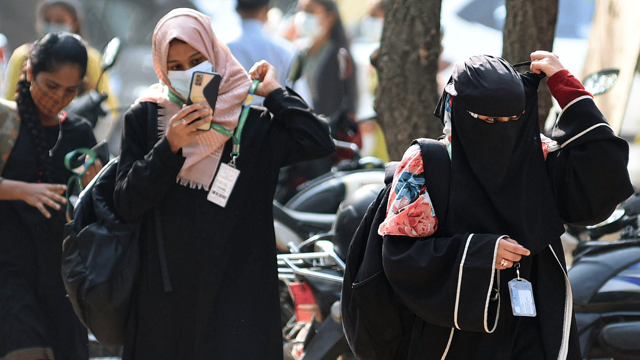 Students attend class in Maharani college in Bengaluru after PU and degree colleges in Karnataka reopened on Wednesday. Credit: DH Photo