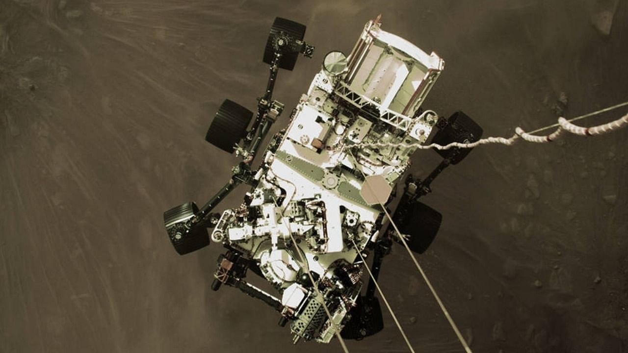 The Mars 2020 descent stage lowers NASAÃ¢Â€Â™s Perseverance rover onto the Red Planet on February 18, 2021. The image is from video captured by a camera aboard the descent stage. Credit: IANS File Photo