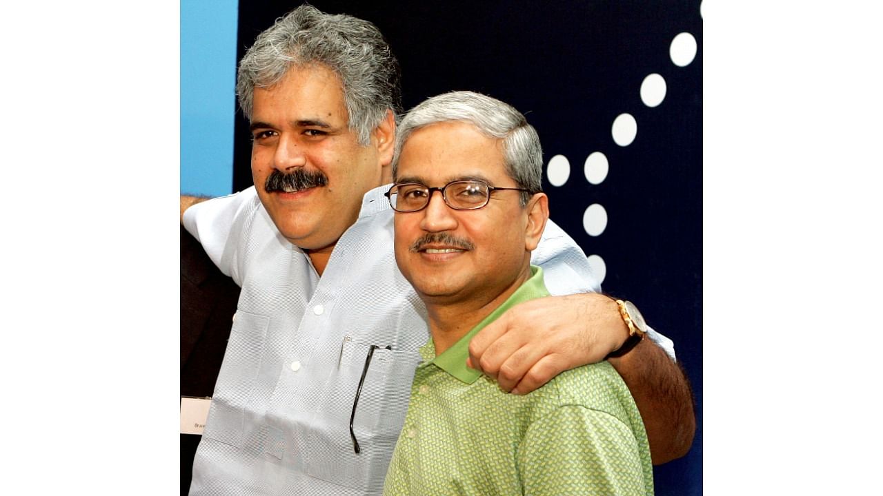 Rahul Bhatia and Rakesh Gangwal pose at the launch of revenue operations of IndiGo, India's newest private low-fare domestic carrier in New Delhi on July 31, 2006. Credit: Reuters File Photo