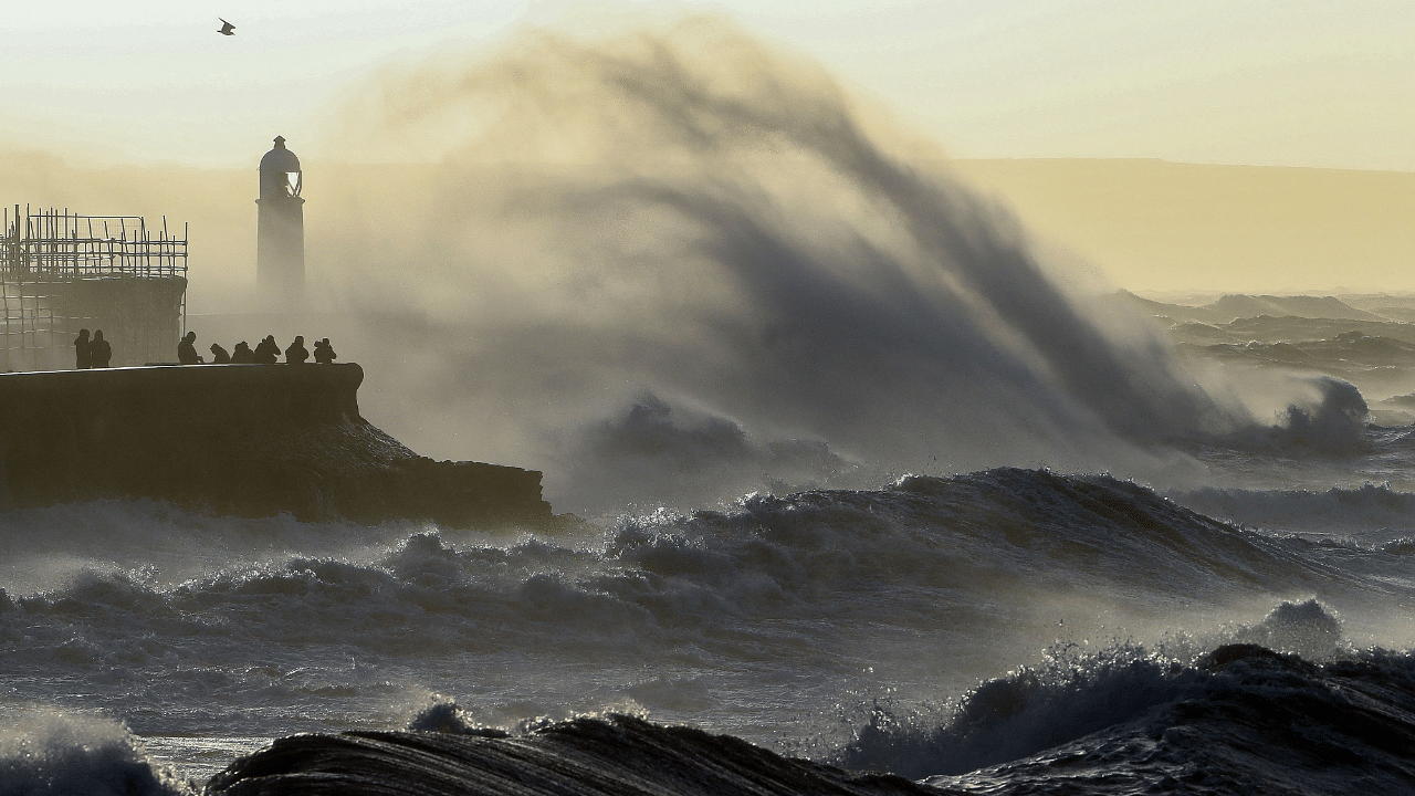 Waves crash against the sea wall at Porthcawl, south Wales. Credit: AFP Photo