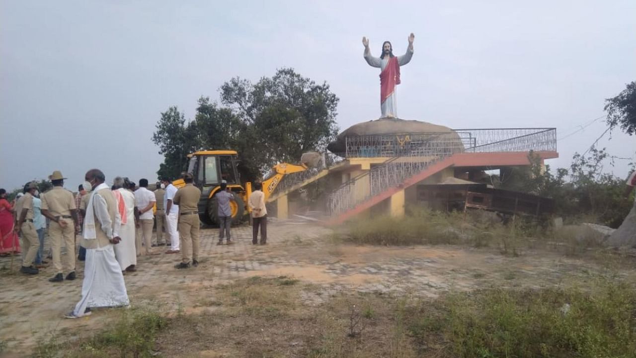 The local administration demolished a 20-foot tall statue of Jesus and other structures at Gokunte near Mulbagal in Kolar district recently. Credit: DH Photo