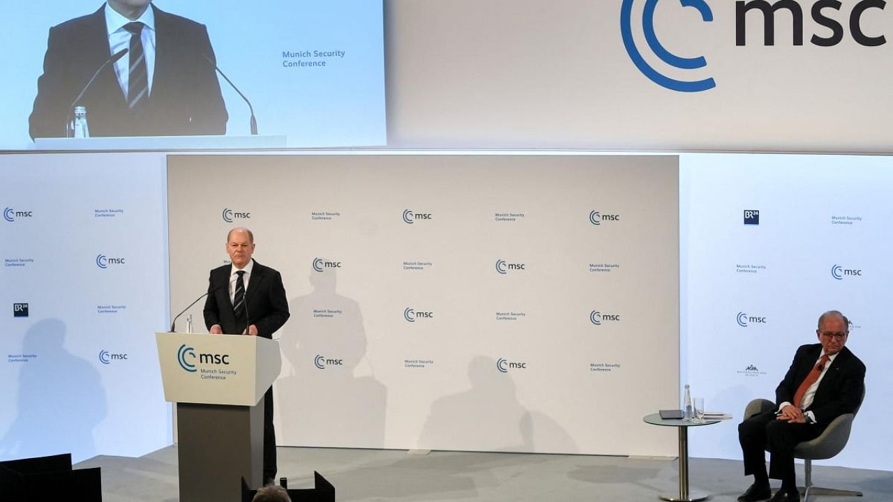 German Chancellor Olaf Scholz speaks next to Munich Security Conference (MSC) chairman Wolfgang Ischinger during the event, in Munich. Credit: Reuters photo