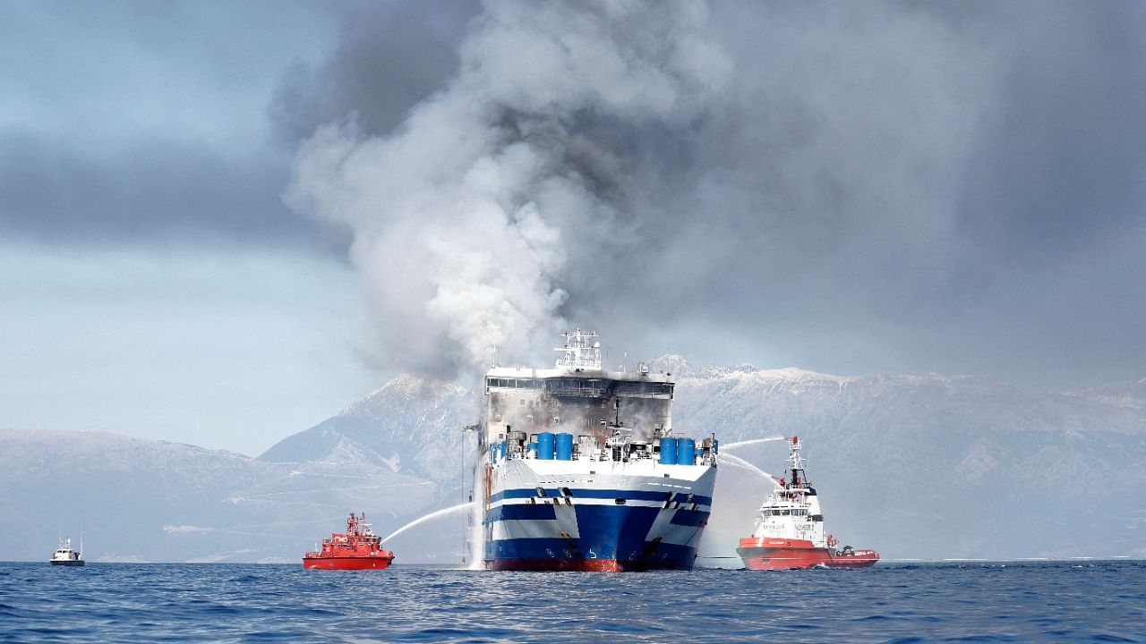 Smoke rises from the Italian-flagged Euroferry Olympia, which sailed from Greece to Italy early on Friday and caught fire, off the coast of Corfu, Greece, February 19, 2022. Credit: Reuters Photo