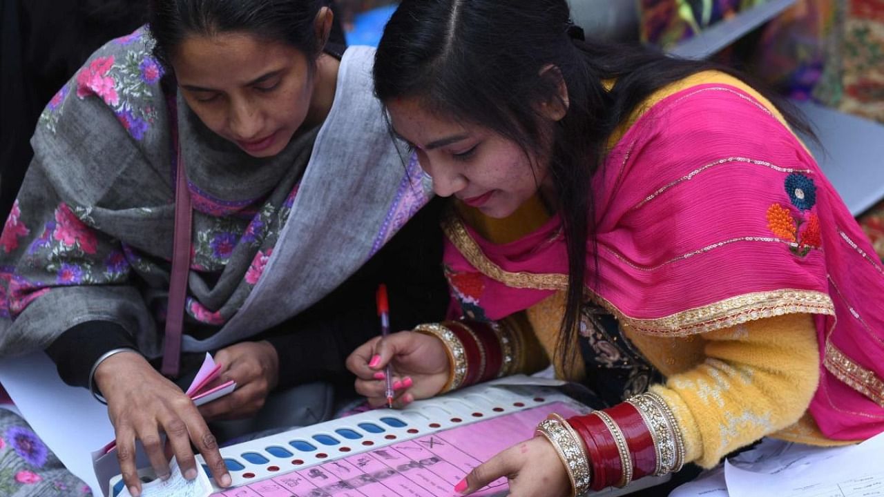 Polling officials check EVMs on the eve of the Punjab Assembly elections in Amritsar on Saturday. Credit: AFP Photo
