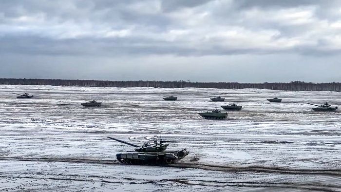 This handout video grab released by the Russian Defence Ministry on February 4, 2022 shows tanks on a snow-covered field during joint exercises of the armed forces of Russia and Belarus as part of an inspection of the Union State's Response Force, at a firing range in Belarus. Credit: AFP File Photo