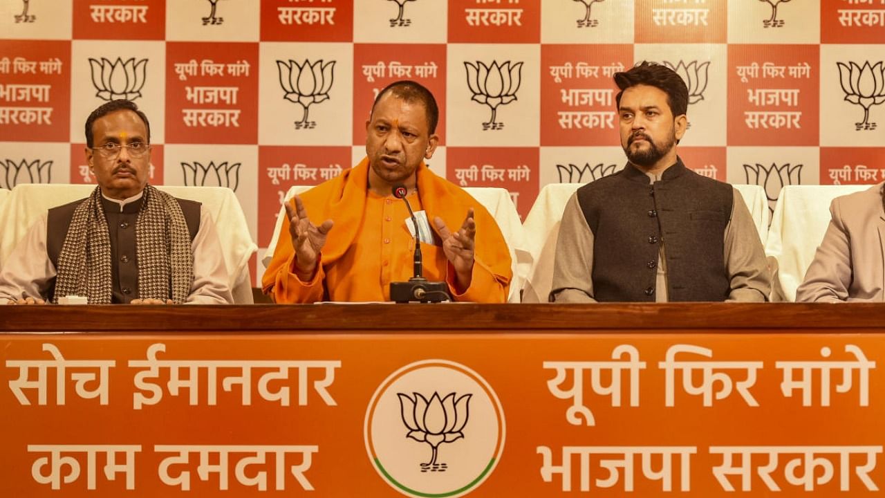 Deputy C M Dinesh Sharma, along with UP CM Adityanath and Union Minister Anurag Thakur. Credit: PTI Photo