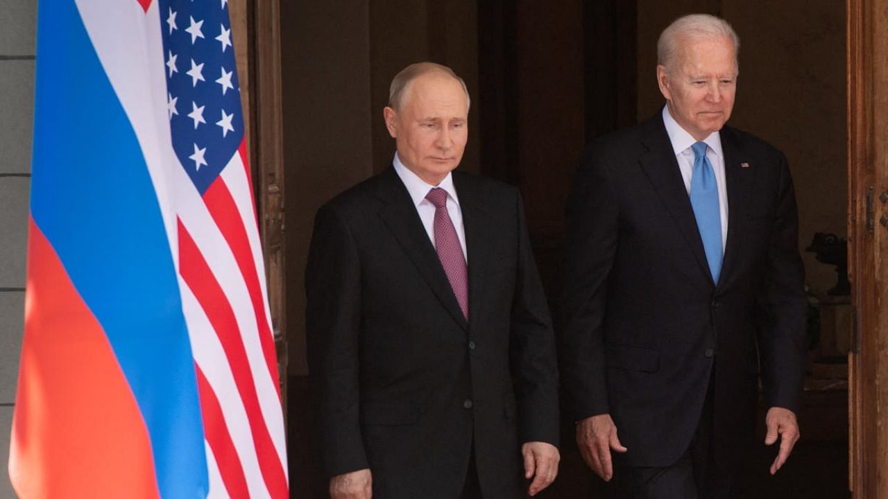 File Photo of Vladimir Putin and Joe Biden. Credit: AFP Photo