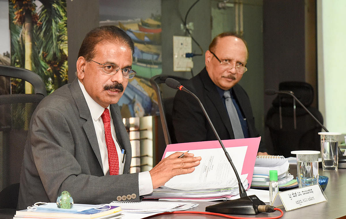 KERC chairman H M Manjunath and member M D Ravi during a hearing on power tariff revision proposed by Mescom, at DC’s office hall, in Mangaluru, on Monday. 