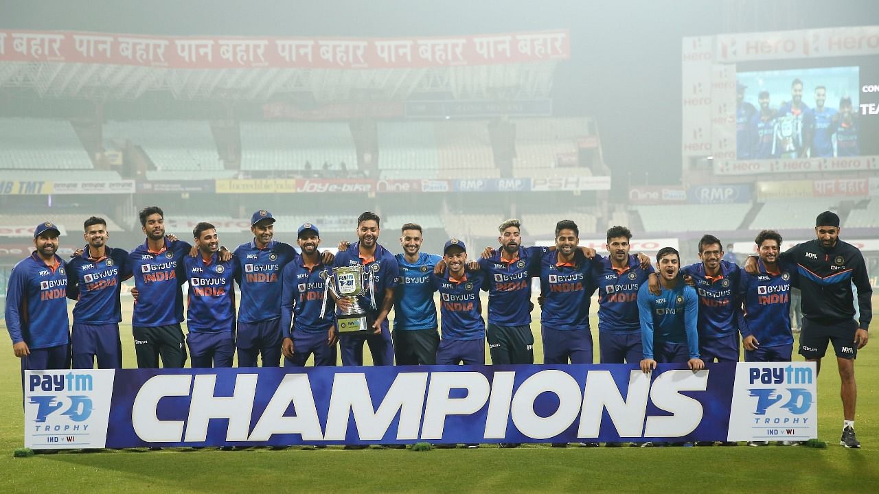 Indian players pose with the trophy after winning the 3rd and final T20 cricket match of the series against West Indies. Credit: Twitter/@BCCI