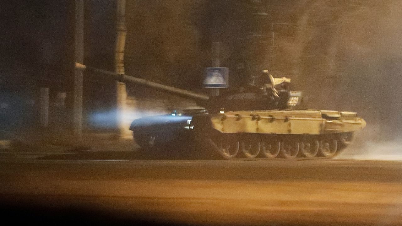 A tank drives along a street after Russian President Vladimir Putin ordered the deployment of Russian troops to two breakaway regions in eastern Ukraine following the recognition of their independence, in the separatist-controlled city of Donetsk, Ukraine February 22, 2022. Credit: Reuters Photo