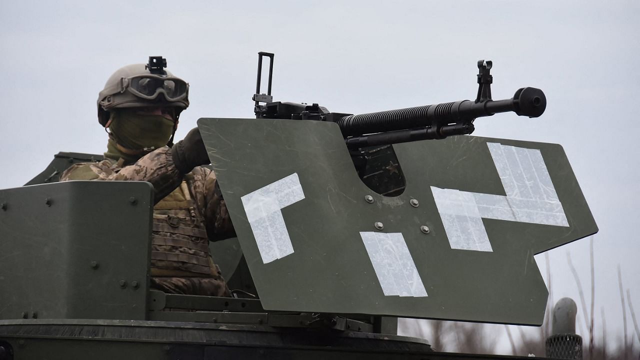 This handout picture released on February 21, 2022 by the press service of the General Staff of the Ukrainian Armed Forces in an unknown location of Ukraine shows Ukrainian soldiers taking part in exercises. Credit: AFP Photo