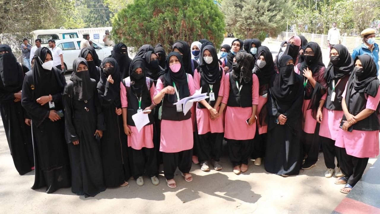 About 39 students of KLE Society’s Lingaraj College in Belagavi staged a protest near the deputy commissioner’s office seeking permission to wear hijab. Credit: DH Photo