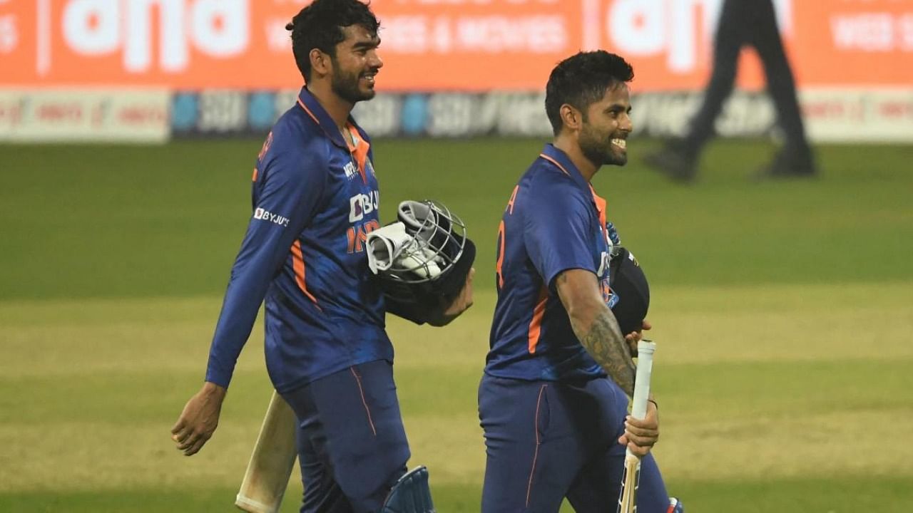 India's Venkatesh Iyer and teammate India's Suryakumar Yadav (R). Credit: AFP Photo