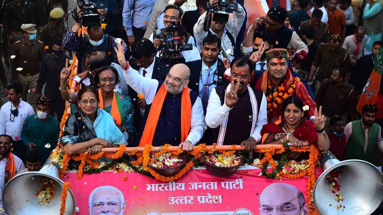Home Minister and Bhartiya Janata Party (BJP) leader Amit Shah (C) gestures during a road show ahead of Uttar Pradesh state assembly elections. Credit: AFP Photo