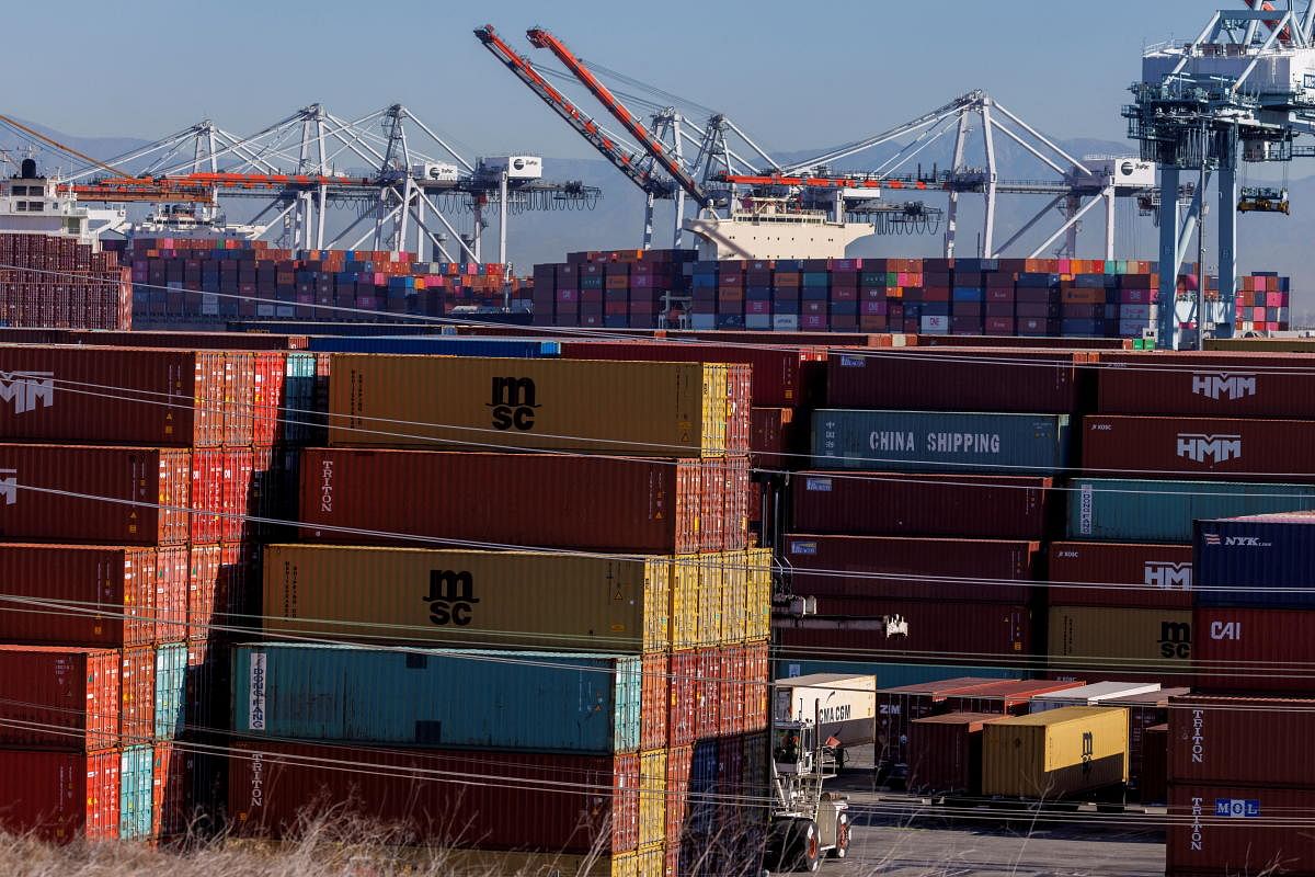 Stacked containers are shown as ships unload their cargo at the Port of Los Angeles in Los Angeles, California, US. Credit: Reuters Photo