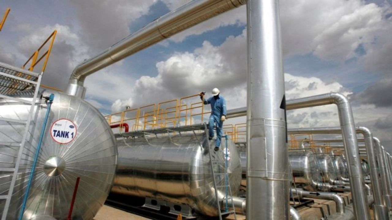 A Cairn India employee works at a storage facility for crude oil at Mangala oil field at Barmer in Rajasthan. Credit: Reuters File Photo 