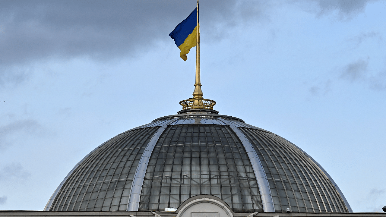 Ukrainian the flag fluttering above the dome of the parliament in Kyiv. Credit: AFP Photo