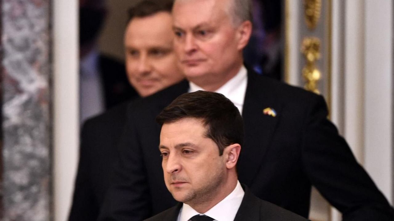  Ukrainian President Volodymyr Zelensky (front) and his counterparts from Lithuania Gitanas Nauseda (C) and Poland Andrzej Duda arrive for a joint press conference following their talks in Kyiv on February 23, 2022. Credit: AFP Photo