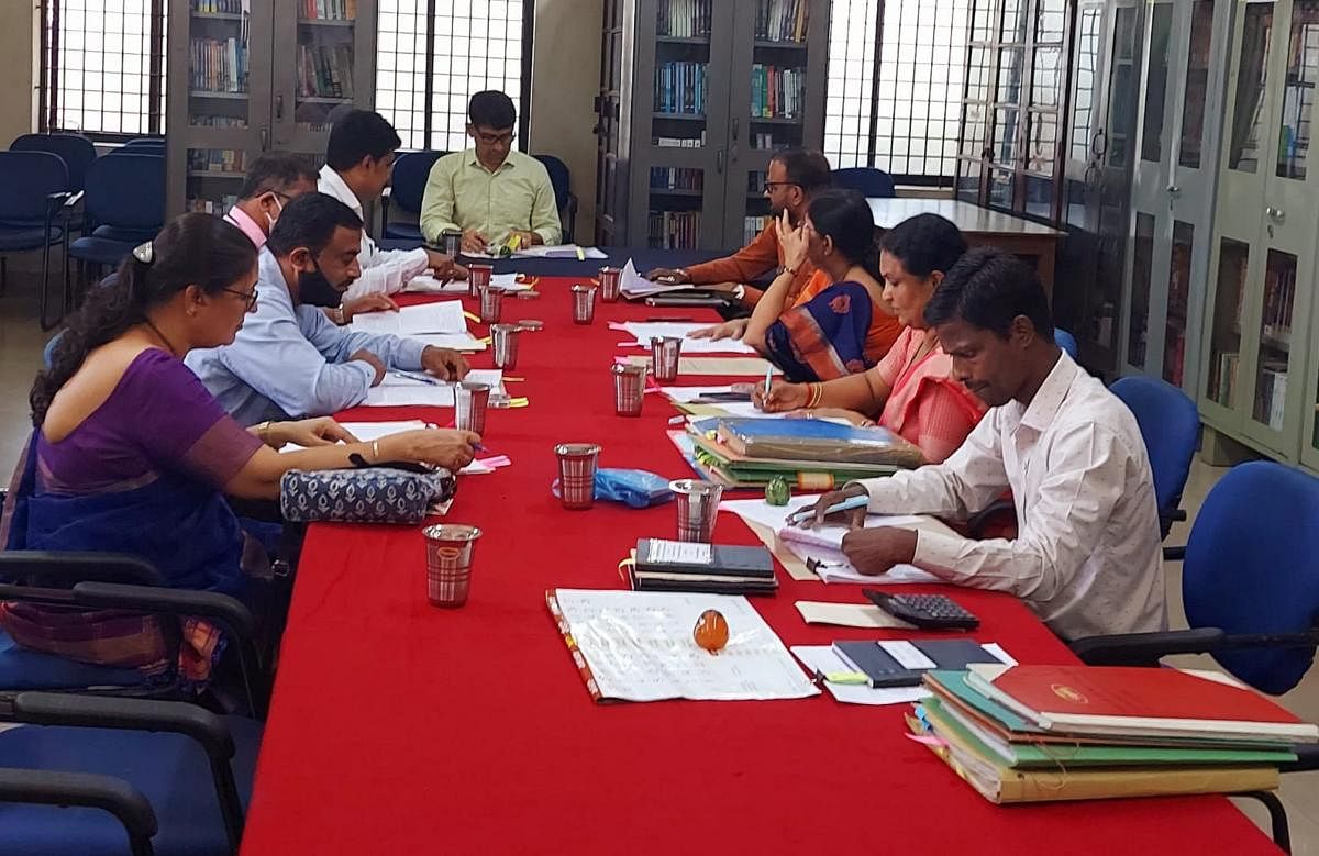 Mayor Premananda Shetty chairs a city library authority meeting in Mangaluru.