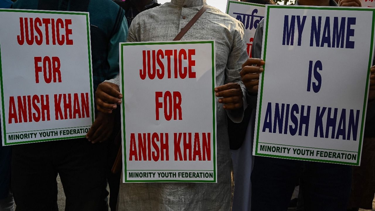 Social activists hold placards demanding justice for the allegedly murdered student leader Anis Khan, during a protest rally in Kolkata. Credit: AFP Photo