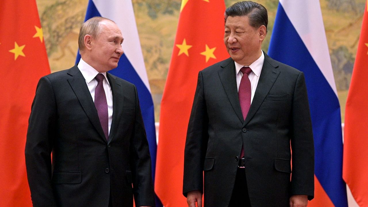 Vladimir Putin with Xi Jinping. Credit: AP/PTI Photo