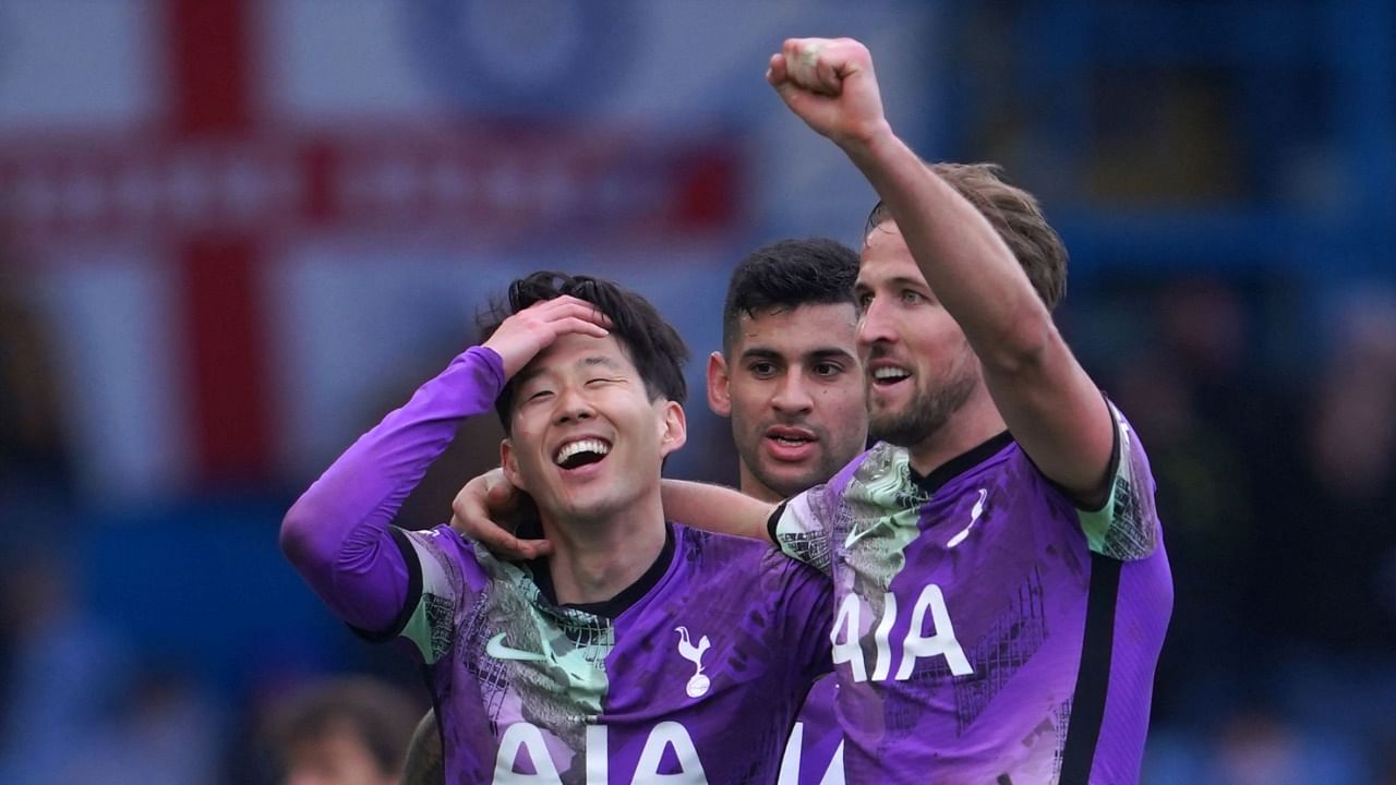 Tottenham Hotspur's South Korean striker Son Heung-Min (L) celebrates with Tottenham Hotspur's English striker Harry Kane (R) after scoring their fourth goal. Credit: AFP Photo
