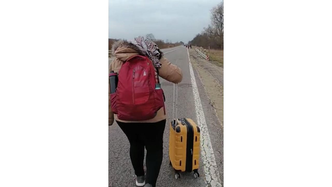 A student from Bengaluru walks towards the Poland border along with her luggage. Credit: Special arrangement
