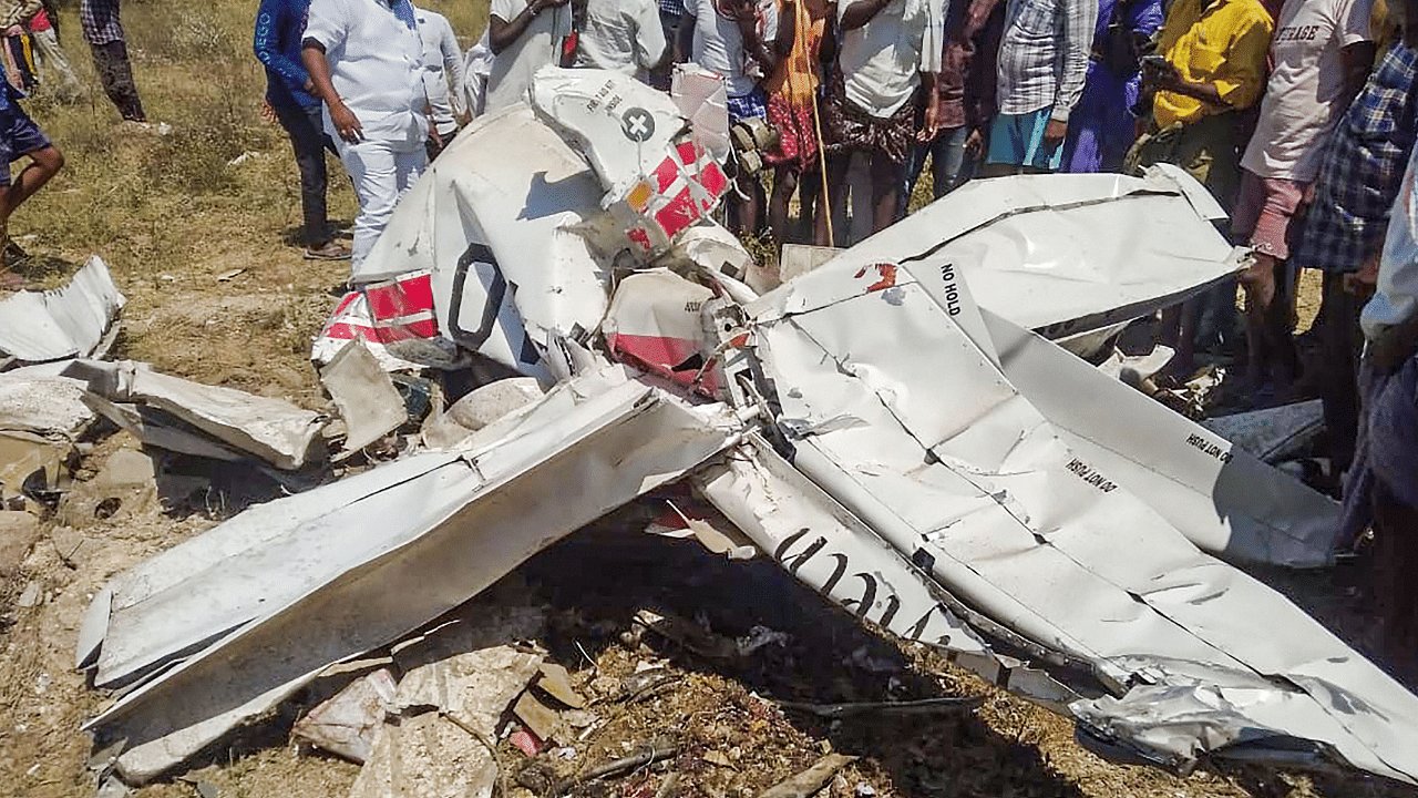  Mangled remains of a chopper after it crashed at Tungaturthy village in Nalgonda district, Saturday, Feb. 26, 2022. Credit: PTI Photo