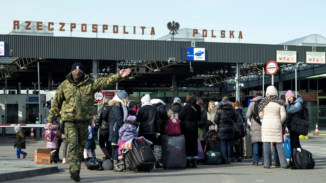 People arrive at the border crossing between Poland and Ukraine. Credit: Reuters Photo