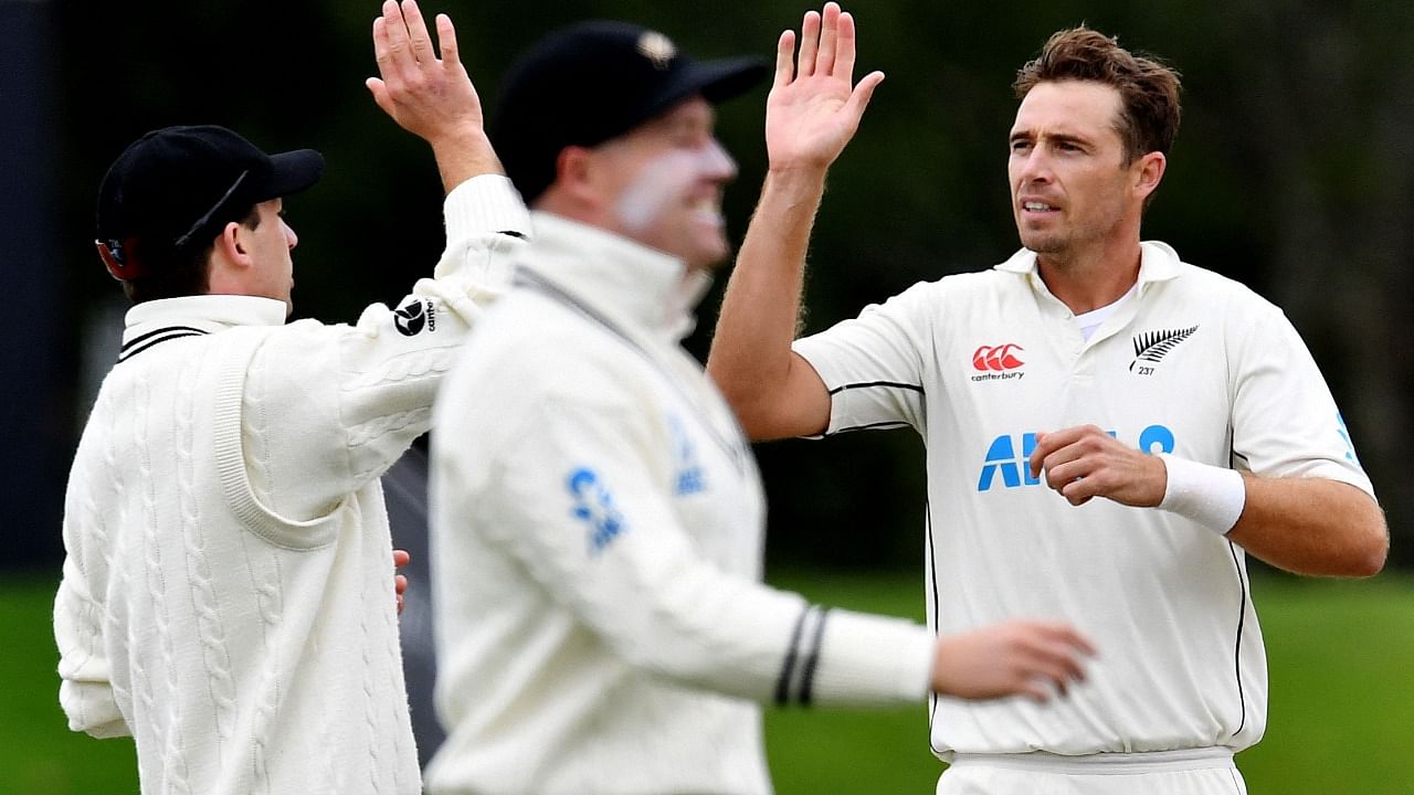 New Zealand's Tim Southee (R) celebrates the dismissal of South Africa's Dean Elgar with teammates on day three of the second cricket Test match between New Zealand and South Africa. Credit: AFP Photo
