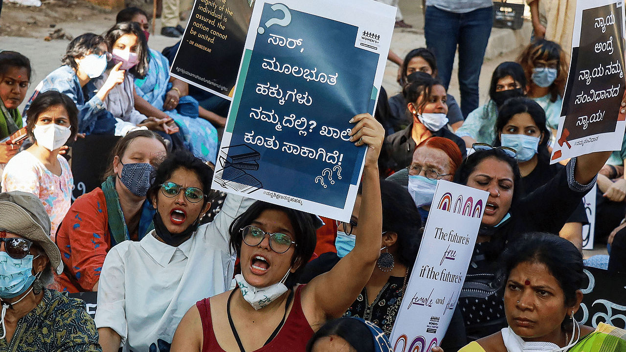 LGBT members and supporters holding placards raise slogans in a protest march, in support of 'Hijab' and against alleged harassment of Muslim women, in Bengaluru. Credit: PTI Photo