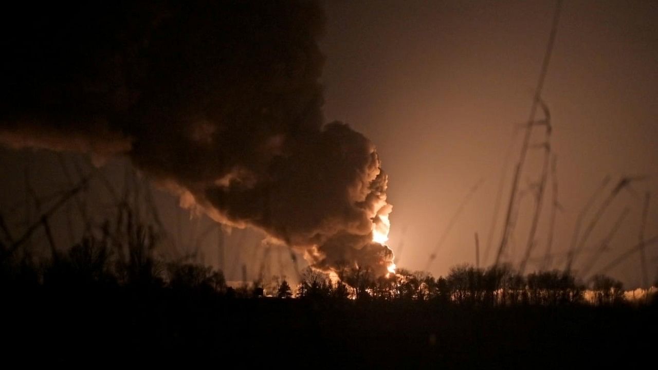 A view shows a burning oil depot reportedly hit by shelling near the military airbase Vasylkiv in the Kyiv region. Credit: Reuters Photo