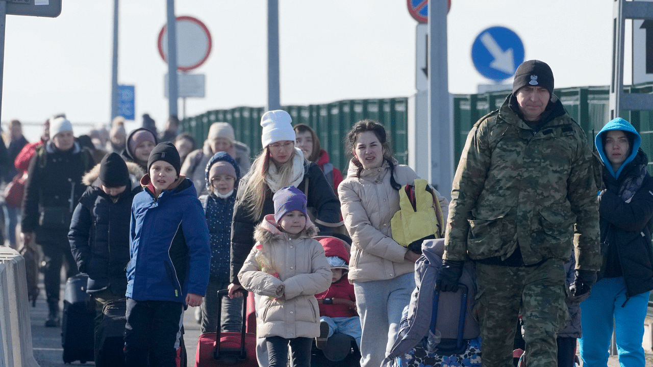 Refugees from Ukraine arrive to Poland. Credit: AP Photo