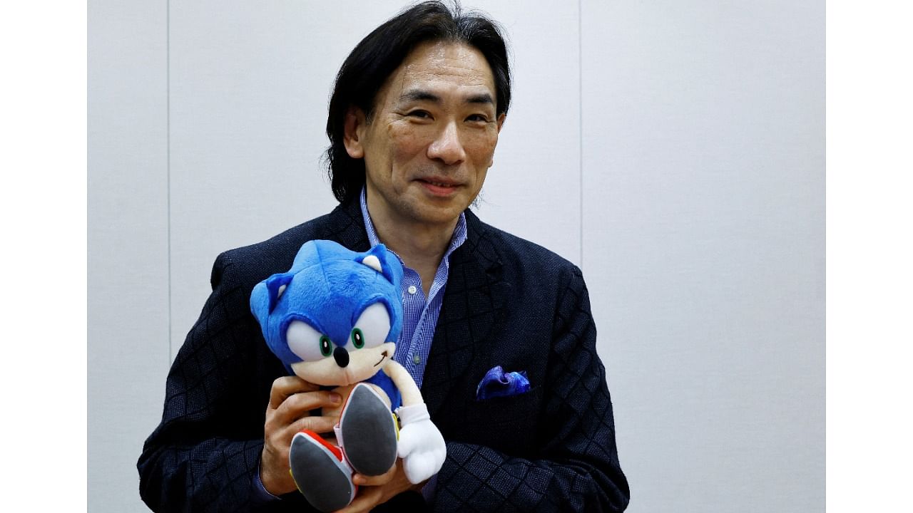 Sega Corp's Co-Chief Operation Officer Shuji Utsumi poses with 'Sonic the Hedgehog' toy. Credit: Reuters Photo