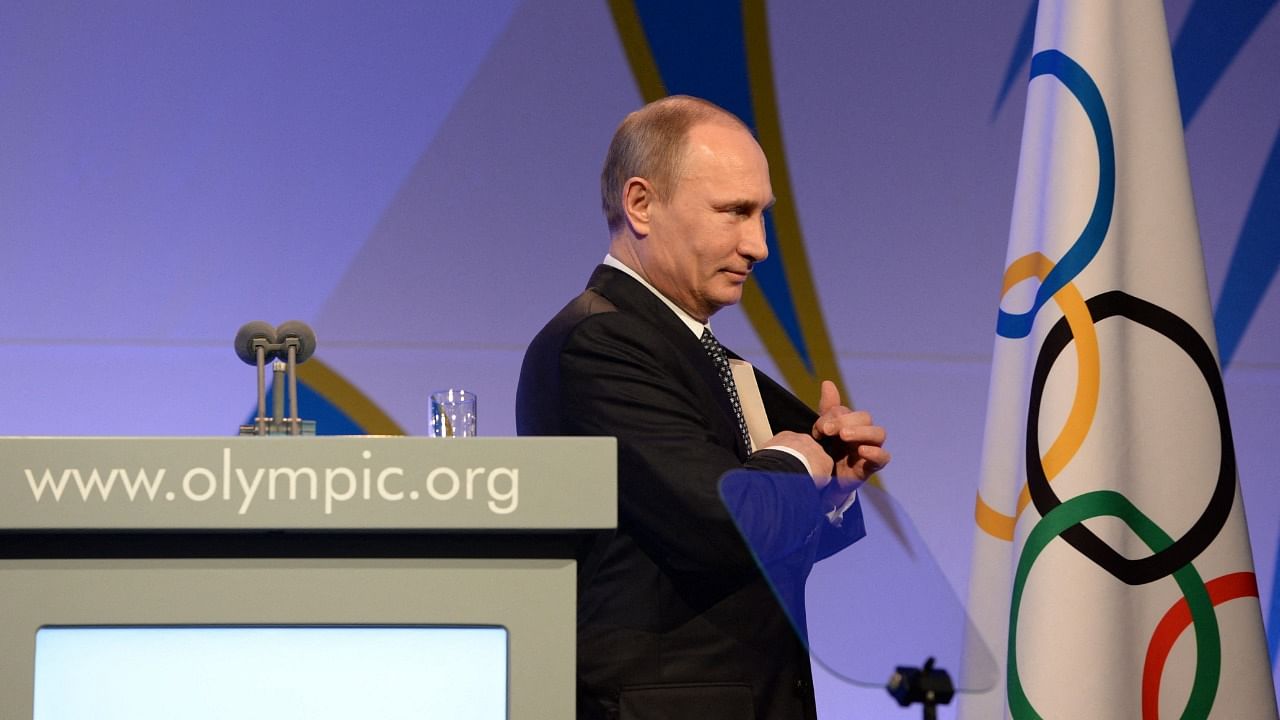 Russian President Vladimir Putin leaves the stage after his speech at the International Olympic Committee (IOC) Gala Dinner on February 6, 2014 in Sochi. Credit: AFP Photo