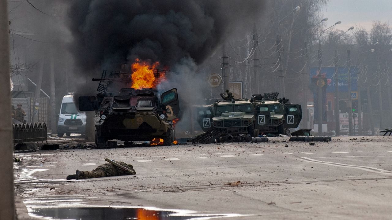 A Russian armoured personnel carrier burns in the ongoing war. Credit: AP/PTI Photo