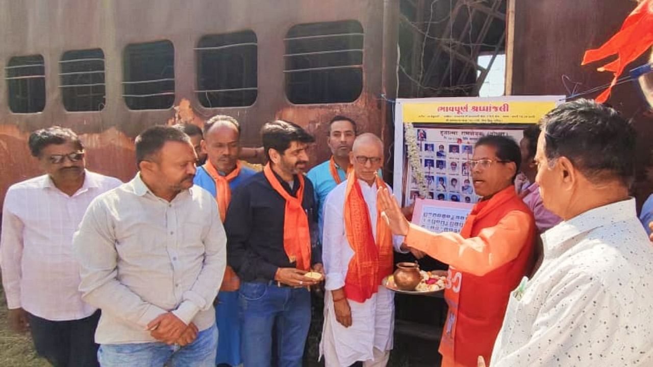VHP members offered prayers outside S-6 coach of Sabarmati Express train which was burnt on February 27, 2002, that killed 59 passengers. Credit: Special Arrangement