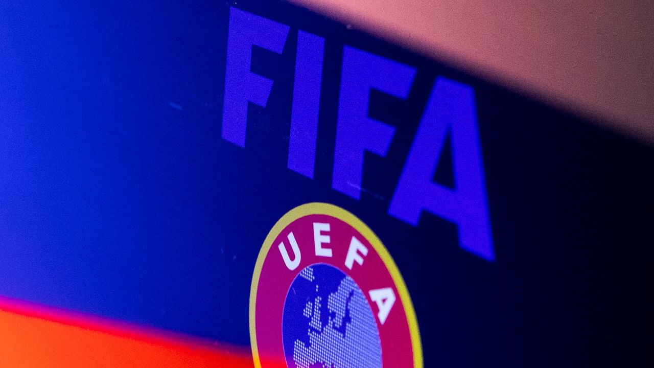 Illustration shows FIFA and UEFA logos and Russian flag. Credit: Reuters Illustration