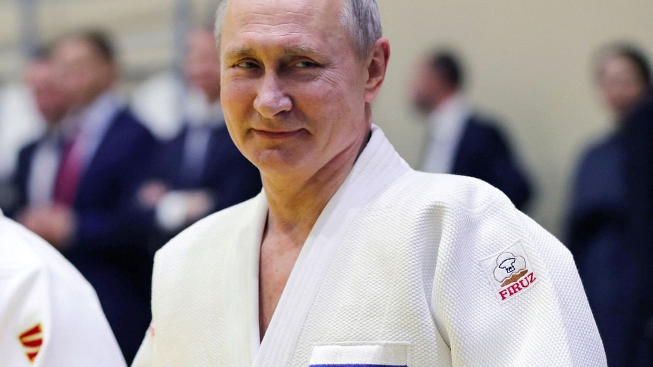 Putin in a Judogi during a session with Russian athletes. Credit: AFP File Photo