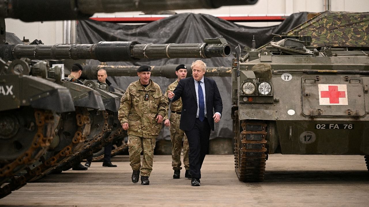 British PM Johnson and NATO Secretary-General Stoltenberg meet NATO troops at Tapa Military Base. Credit: Reuters Photo