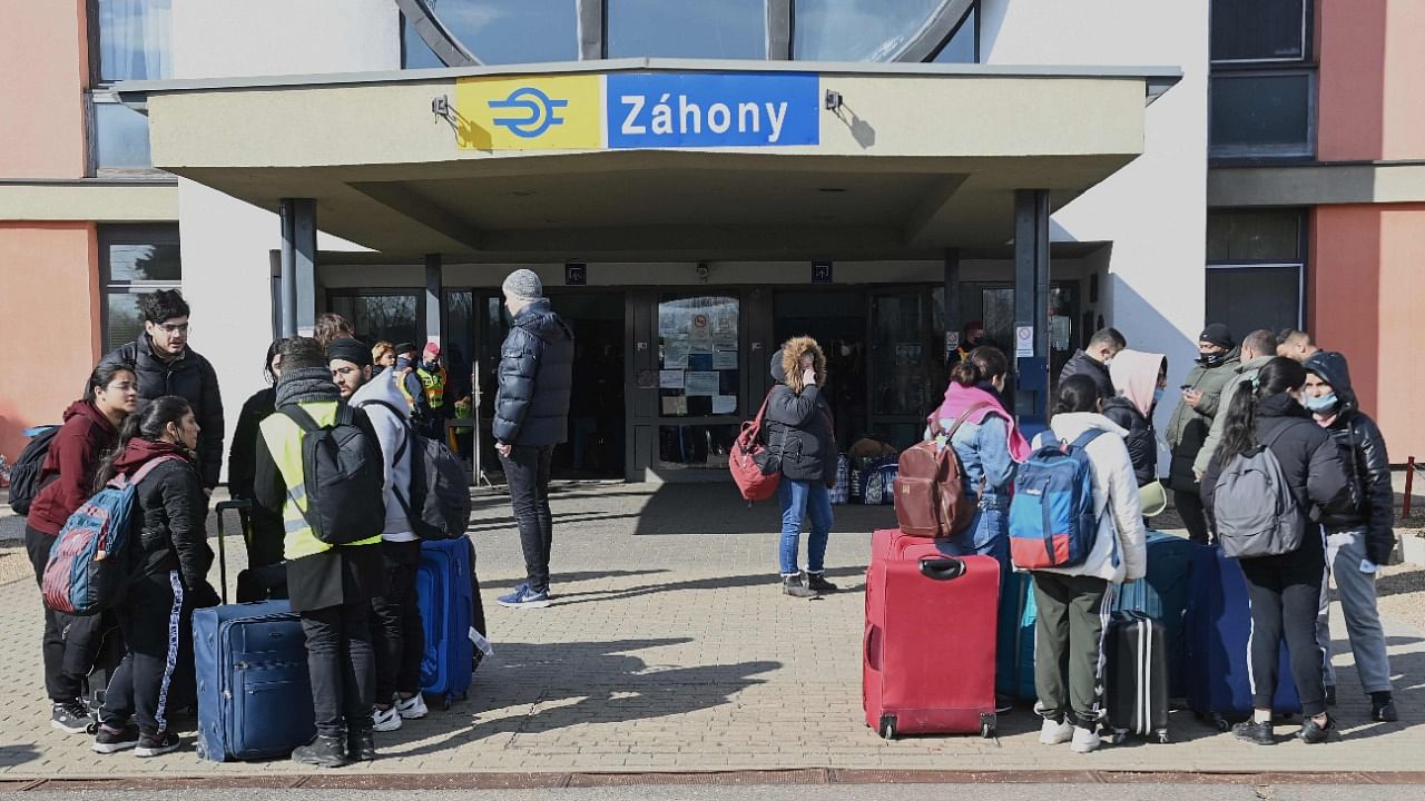 Refugees arriving from Ukraine including African and Indian students of Kyiv University wait for their connection train to Budapest at the railway station in the Hungarian-Ukrainian border town of Zahony on March 1, 2022. Credit: AFP Photo