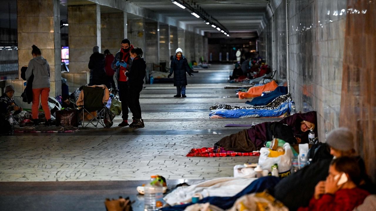 Civilians take shelter at an underground metro station in Kyiv. Credit: AFP Photo