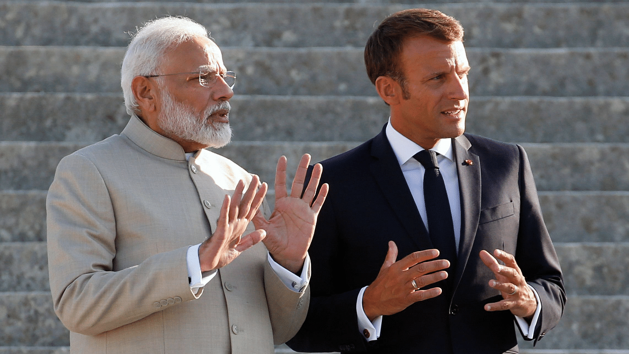 French President Emmanuel Macron (R) and Indian Prime Minister Narendra Modi. Credit: AFP Photo