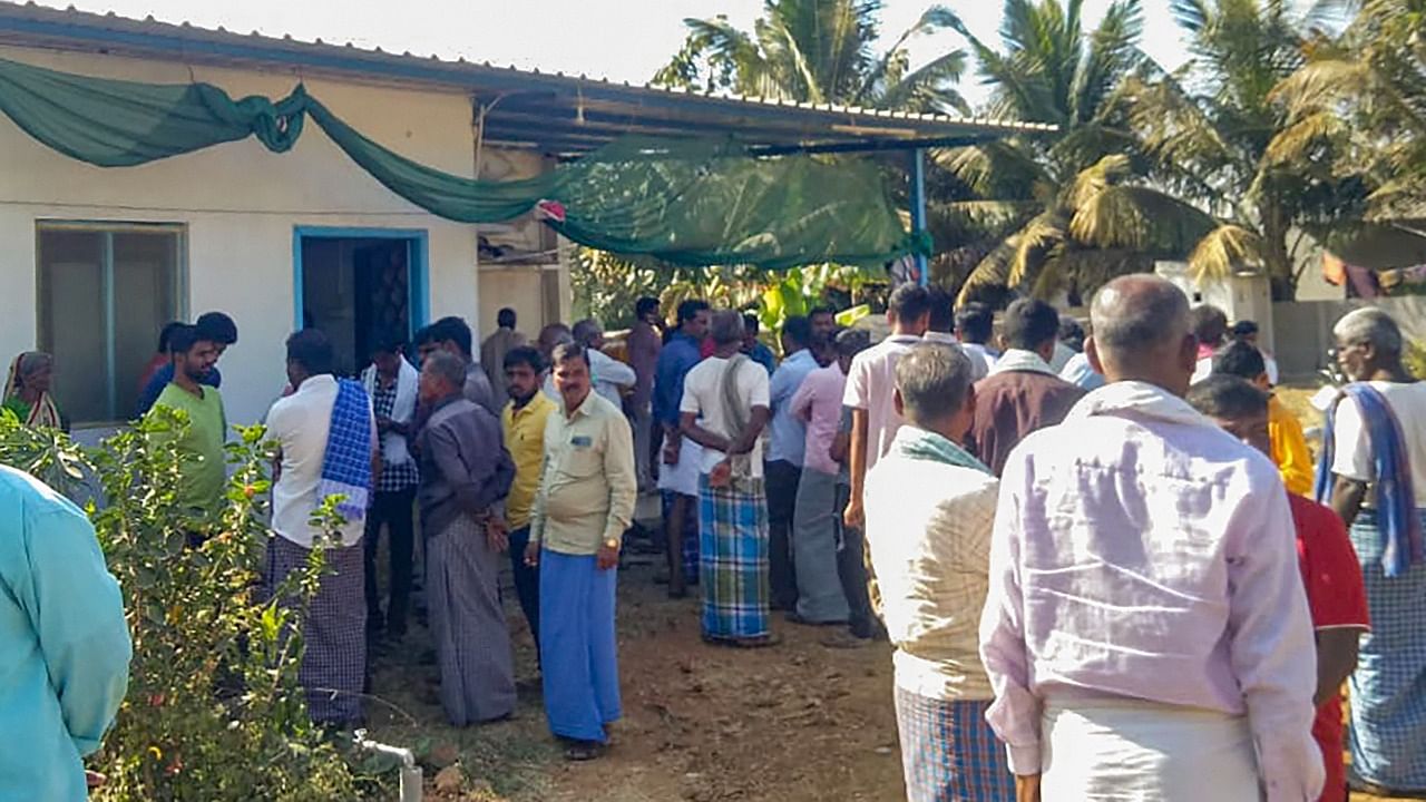 Locals gather at the residence of Naveen Shekharappa, a final year medical student, who passed away due to Russian shelling in the Ukrainian city of Kharkiv, at Chalageri village, in Haveri, Tuesday, March 1, 2022. Credit: PTI Photo