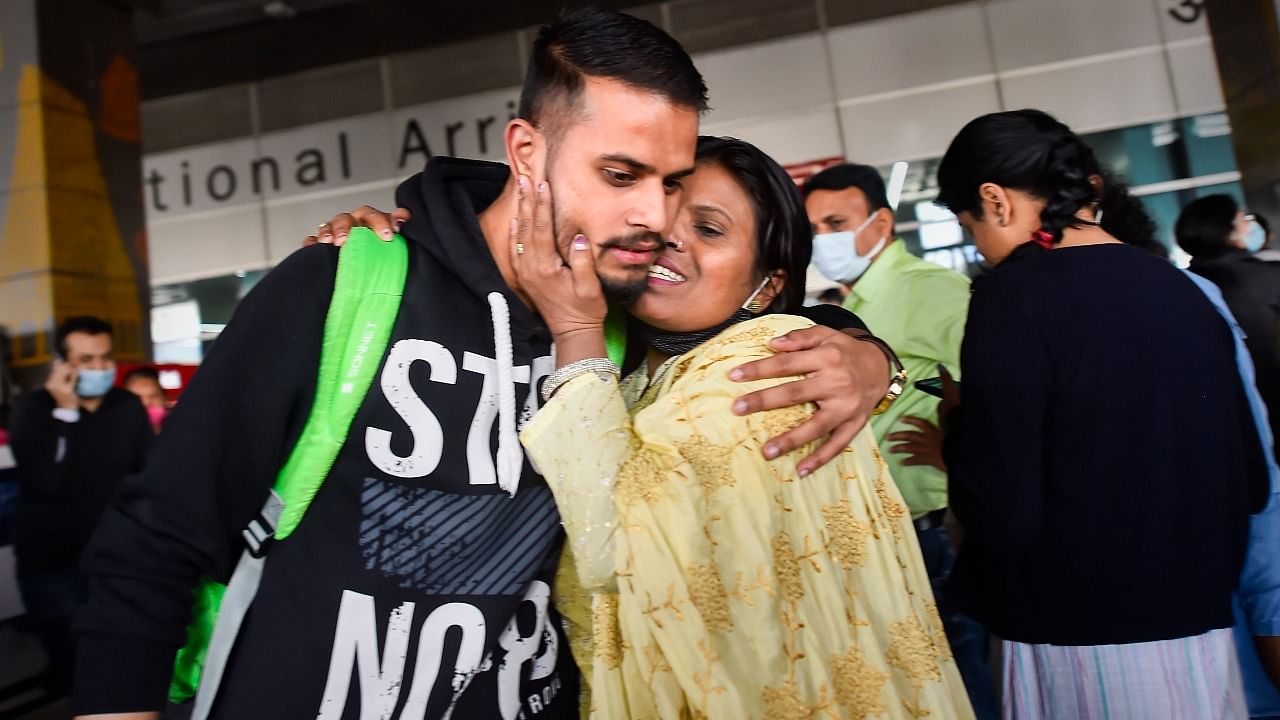 A student is greeted on his return at the IGI Airport. Credit: PTI Photo