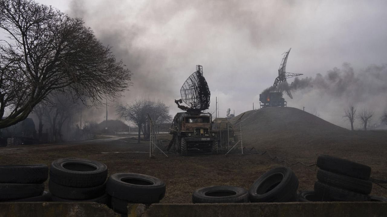 Smoke rises from an air defence base in the aftermath of an apparent Russian strike in Mariupol, Ukraine, Thursday, Feb. 24, 2022. Credit: AP Photo